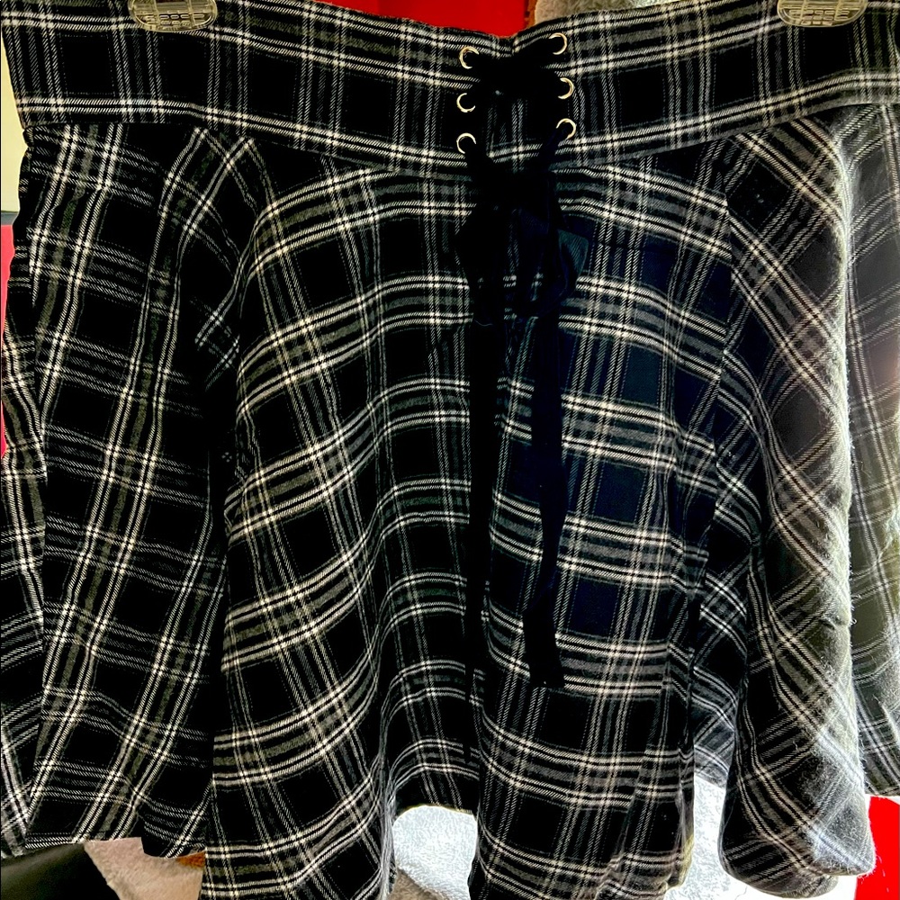 Tartan miniskirt with tie detail.